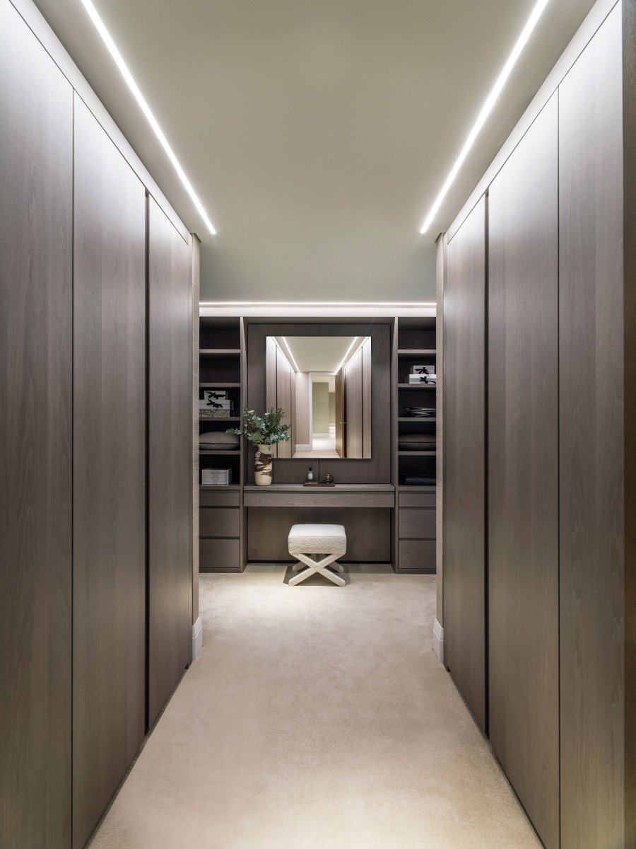 Built-in storage and bespoke cabinetry in a rich timber veneer