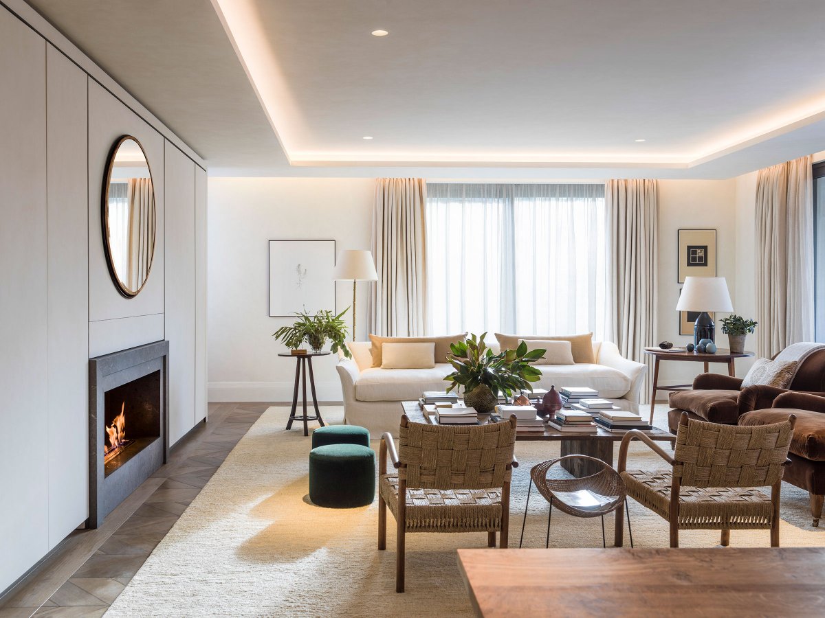 Stylish marble fireplace and chevron oak flooring in main reception room