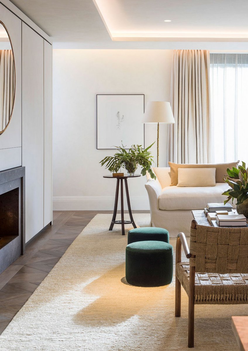 Stylish marble fireplace and chevron oak flooring in main reception room